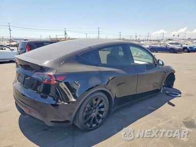 Trzecie zdjęcie samochodu z tyłu: 2023 TESLA MODEL Y VIN:7SAYGDEE9PA199071 - miniatura