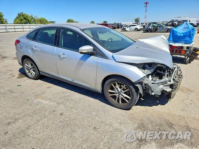 Czwarte zdjęcie samochodu z boku: 2017 FORD FOCUS SE VIN:1FADP3F28HL341086 - miniatura