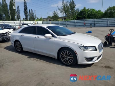 Czwarte zdjęcie samochodu z boku: 2017 LINCOLN MKZ PREMIERE VIN:3LN6L5A99HR646527 - miniatura