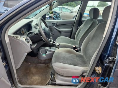 Zdjęcie 7 z 12 samochodu: 2003 FORD FOCUS LX VIN:1FAFP33PX3W267816 - miniatura
