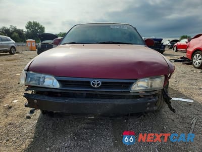Piąte zdjęcie samochodu w środku: 1995 TOYOTA COROLLA LE VIN:1NXAE00B4SZ266197 - miniatura