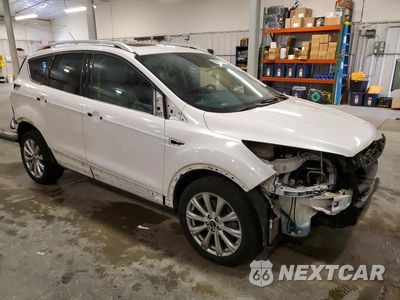 Czwarte zdjęcie samochodu z boku: 2017 FORD ESCAPE TITANIUM VIN:1FMCU9J90HUD71081 - miniatura