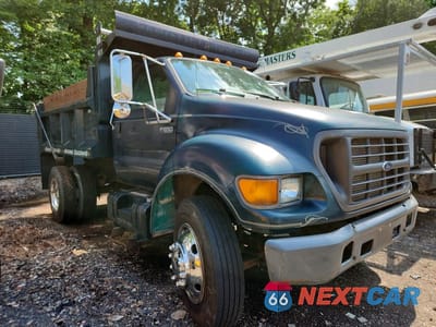 Czwarte zdjęcie samochodu z boku: 2000 FORD F650 SUPER DUTY DUMP TRUCK VIN:3FDNF6563YMA30912 - miniatura