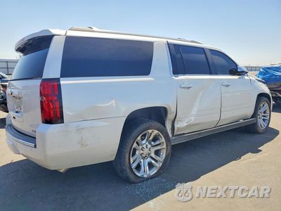 Trzecie zdjęcie samochodu z tyłu: 2019 CHEVROLET SUBURBAN K1500 PREMIER VIN:1GNSKJKJ4KR400521 - miniatura