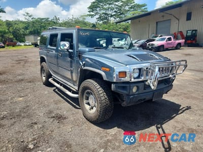 Czwarte zdjęcie samochodu z boku: 2005 HUMMER H2 VIN:5GRGN23U55H125352 - miniatura