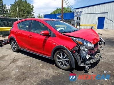Czwarte zdjęcie samochodu z boku: 2018 TOYOTA PRIUS C FOUR VIN:JTDKDTB35J1601163 - miniatura