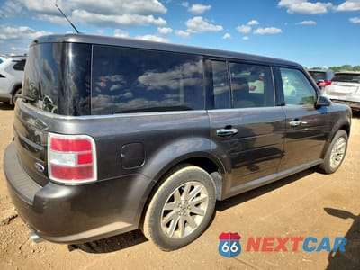 Trzecie zdjęcie samochodu z tyłu: 2018 FORD FLEX SEL VIN:2FMGK5C8XJBA09887 - miniatura