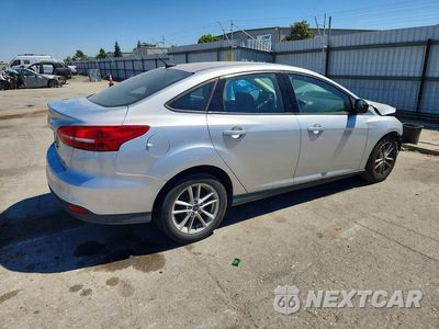 Trzecie zdjęcie samochodu z tyłu: 2017 FORD FOCUS SE VIN:1FADP3F28HL341086 - miniatura