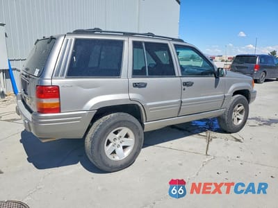 Trzecie zdjęcie samochodu z tyłu: 1998 JEEP GRAND CHEROKEE LIMITED 5.9L VIN:1J4GZ88Z3WC162700 - miniatura