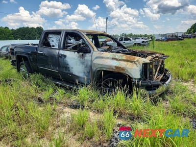 Czwarte zdjęcie samochodu z boku: 2018 GMC SIERRA K1500 SLT VIN:3GTU2NEC3JG546400 - miniatura