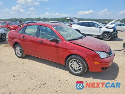 Czwarte zdjęcie samochodu z boku: 2005 FORD FOCUS VIN:1FAFP34N25W304678 - miniatura
