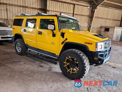 Czwarte zdjęcie samochodu z boku: 2004 HUMMER H2 VIN:5GRGN23U14H121832 - miniatura