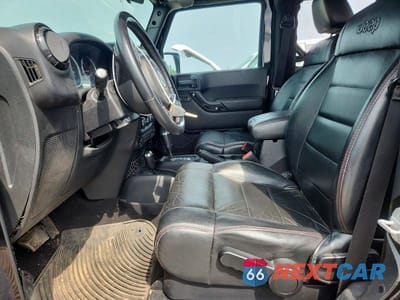 Zdjęcie 7 z 12 samochodu: 2012 JEEP WRANGLER SAHARA VIN:1C4AJWBG7CL264706 - miniatura
