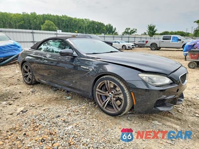 Czwarte zdjęcie samochodu z boku: 2015 BMW M6 VIN:WBSLZ9C53FD651227 - miniatura