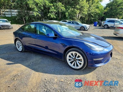 Czwarte zdjęcie samochodu z boku: 2022 TESLA MODEL 3 VIN:5YJ3E1EB9NF289757 - miniatura