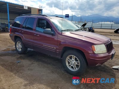 Czwarte zdjęcie samochodu z boku: 1999 JEEP GRAND CHEROKEE LIMITED VIN:1J4GW68N0XC597654 - miniatura