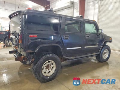 Trzecie zdjęcie samochodu z tyłu: 2003 HUMMER H2 VIN:5GRGN23U83H113399 - miniatura