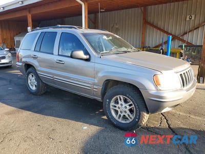 Czwarte zdjęcie samochodu z boku: 1999 JEEP GRAND CHEROKEE LIMITED VIN:1J4GW68N0XC527880 - miniatura