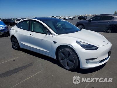 Czwarte zdjęcie samochodu z boku: 2021 TESLA MODEL 3 VIN:5YJ3E1EA1MF989875 - miniatura