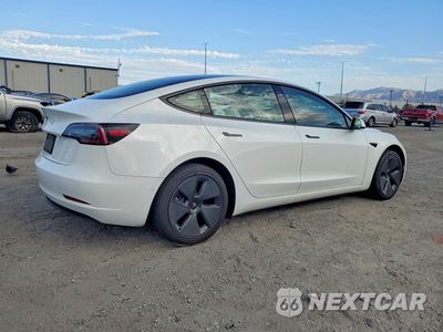 Trzecie zdjęcie samochodu z tyłu: 2021 TESLA MODEL 3 VIN:5YJ3E1EAXMF871033 - miniatura