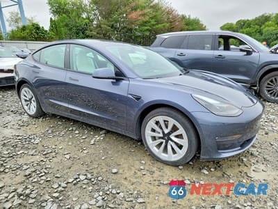 Czwarte zdjęcie samochodu z boku: 2023 TESLA MODEL 3 VIN:5YJ3E1EB3PF663900 - miniatura