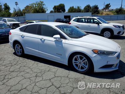 Czwarte zdjęcie samochodu z boku: 2018 FORD FUSION SE HYBRID VIN:3FA6P0LU9JR172118 - miniatura