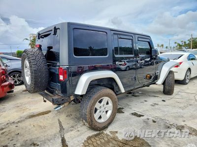 Trzecie zdjęcie samochodu z tyłu: 2013 JEEP WRANGLER UNLIMITED SPORT VIN:1C4HJWDG4DL698045 - miniatura