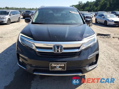 Piąte zdjęcie samochodu w środku: 2022 HONDA PILOT TOURING VIN:5FNYF5H63NB003118 - miniatura