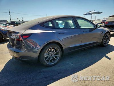 Trzecie zdjęcie samochodu z tyłu: 2023 TESLA MODEL 3 VIN:5YJ3E1EA2PF700345 - miniatura