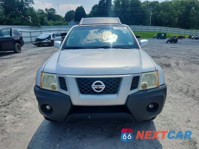 Piąte zdjęcie samochodu w środku: 2010 NISSAN XTERRA X SE VIN:5N1AN0NU0AC525038 - miniatura