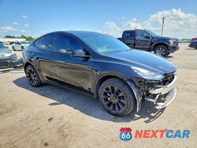 Czwarte zdjęcie samochodu z boku: 2023 TESLA MODEL Y VIN:7SAYGDEE7PA141797 - miniatura
