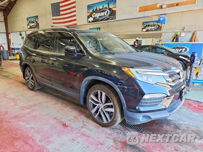 Czwarte zdjęcie samochodu z boku: 2018 HONDA PILOT TOURING VIN:5FNYF5H90JB011956 - miniatura