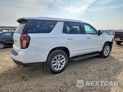 Trzecie zdjęcie samochodu z tyłu: 2021 CHEVROLET TAHOE K1500 PREMIER VIN:1GNSKSKD5MR343104 - miniatura