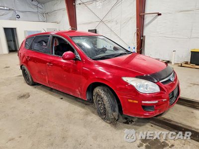 Czwarte zdjęcie samochodu z boku: 2012 HYUNDAI ELANTRA GL VIN:KMHDB8AE2CY141231 - miniatura