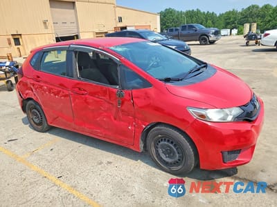 Czwarte zdjęcie samochodu z boku: 2016 HONDA FIT LX VIN:JHMGK5H51GX017704 - miniatura