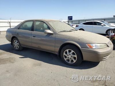 Czwarte zdjęcie samochodu z boku: 1999 TOYOTA CAMRY LE VIN:JT2BF22K4X0228202 - miniatura