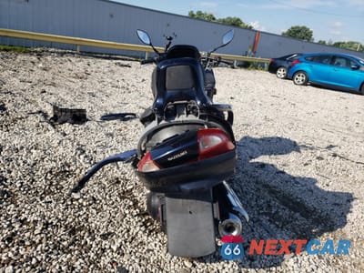 Czwarte zdjęcie samochodu z boku: 2004 SUZUKI AN400 K3 VIN:JS1CK43A942100427 - miniatura