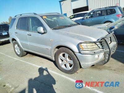 Czwarte zdjęcie samochodu z boku: 2001 MERCEDES-BENZ ML 320 VIN:4JGAB54E21A257959 - miniatura