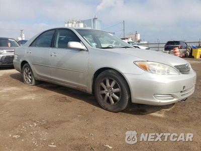 Czwarte zdjęcie samochodu z boku: 2002 TOYOTA CAMRY LE VIN:JTDBF30KX20001377 - miniatura