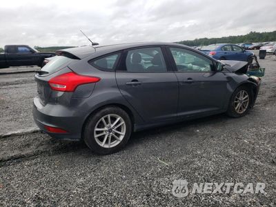 Trzecie zdjęcie samochodu z tyłu: 2017 FORD FOCUS SE VIN:1FADP3K22HL317419 - miniatura