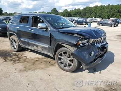 Czwarte zdjęcie samochodu z boku: 2012 JEEP GRAND CHEROKEE OVERLAND VIN:1C4RJFCTXCC238874 - miniatura
