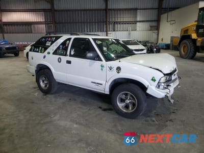 Czwarte zdjęcie samochodu z boku: 2003 CHEVROLET BLAZER VIN:1GNCS18X63K137572 - miniatura