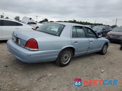 Trzecie zdjęcie samochodu z tyłu: 1999 FORD CROWN VICTORIA LX VIN:2FAFP74W5XX121198 - miniatura