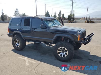 Czwarte zdjęcie samochodu z boku: 1997 JEEP CHEROKEE SE VIN:1J4FJ28S0VL509918 - miniatura