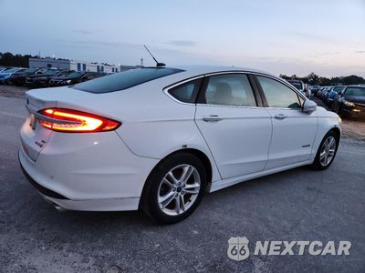Trzecie zdjęcie samochodu z tyłu: 2018 FORD FUSION SE HYBRID VIN:3FA6P0LU0JR281910 - miniatura