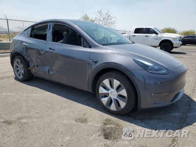 Czwarte zdjęcie samochodu z boku: 2023 TESLA MODEL Y VIN:7SAYGDEE5PF920182 - miniatura