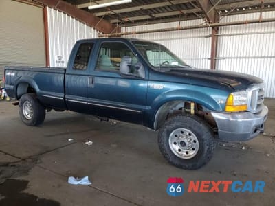 Czwarte zdjęcie samochodu z boku: 1999 FORD F-250 SUPER DUTY VIN:1FTNX21S0XEB10363 - miniatura