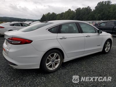 Trzecie zdjęcie samochodu z tyłu: 2018 FORD FUSION SE HYBRID VIN:3FA6P0LU2JR171912 - miniatura