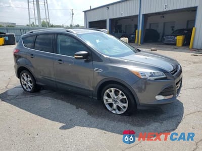 Czwarte zdjęcie samochodu z boku: 2016 FORD ESCAPE TITANIUM VIN:1FMCU0JX9GUC09216 - miniatura