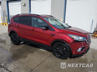 Czwarte zdjęcie samochodu z boku: 2017 FORD ESCAPE TITANIUM VIN:1FMCU0J96HUD41210 - miniatura